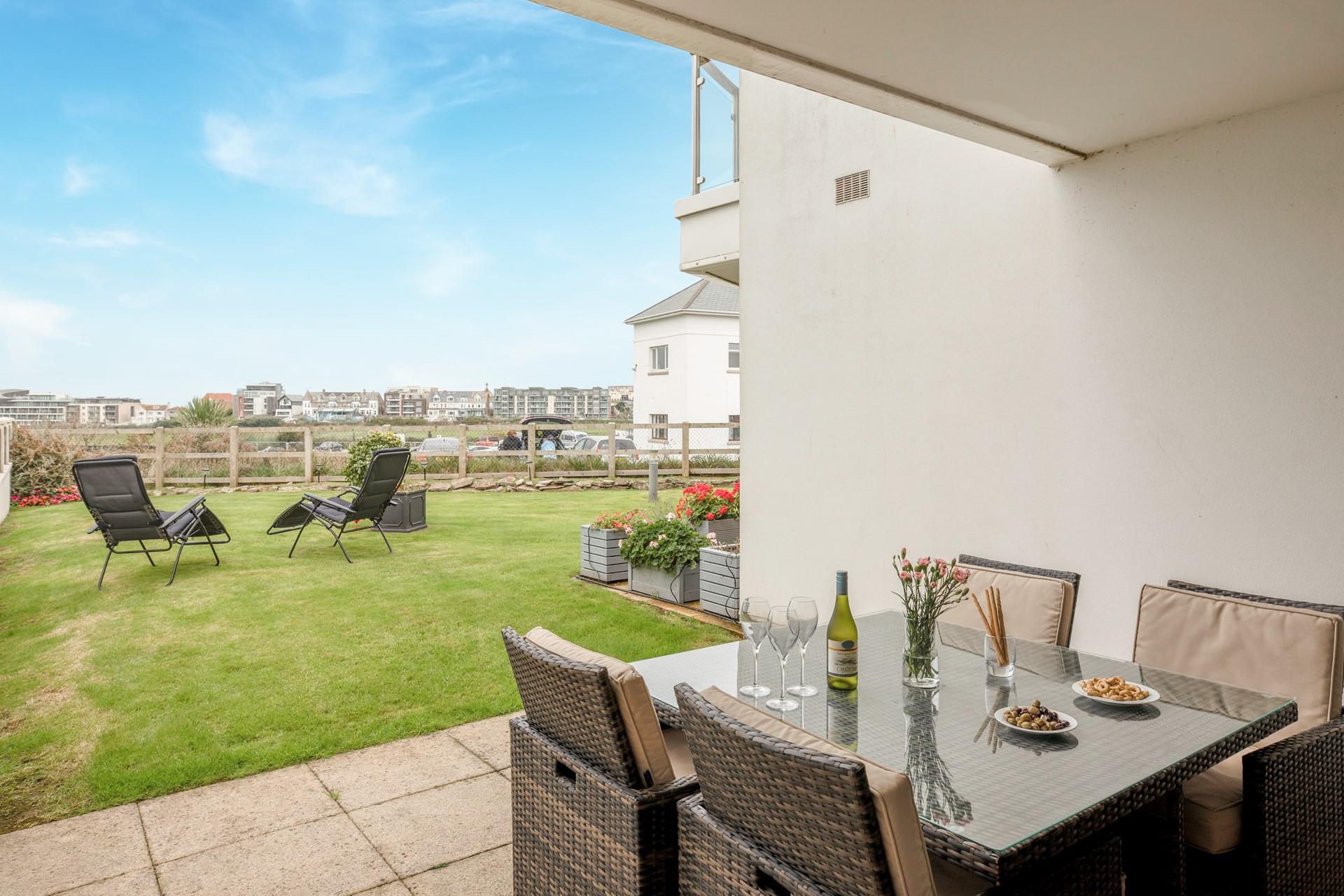 The shared lawn space offers a sunny spot for relaxing.