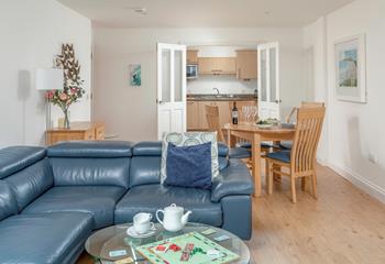 The open plan living and dining area has plenty of space for family fun!