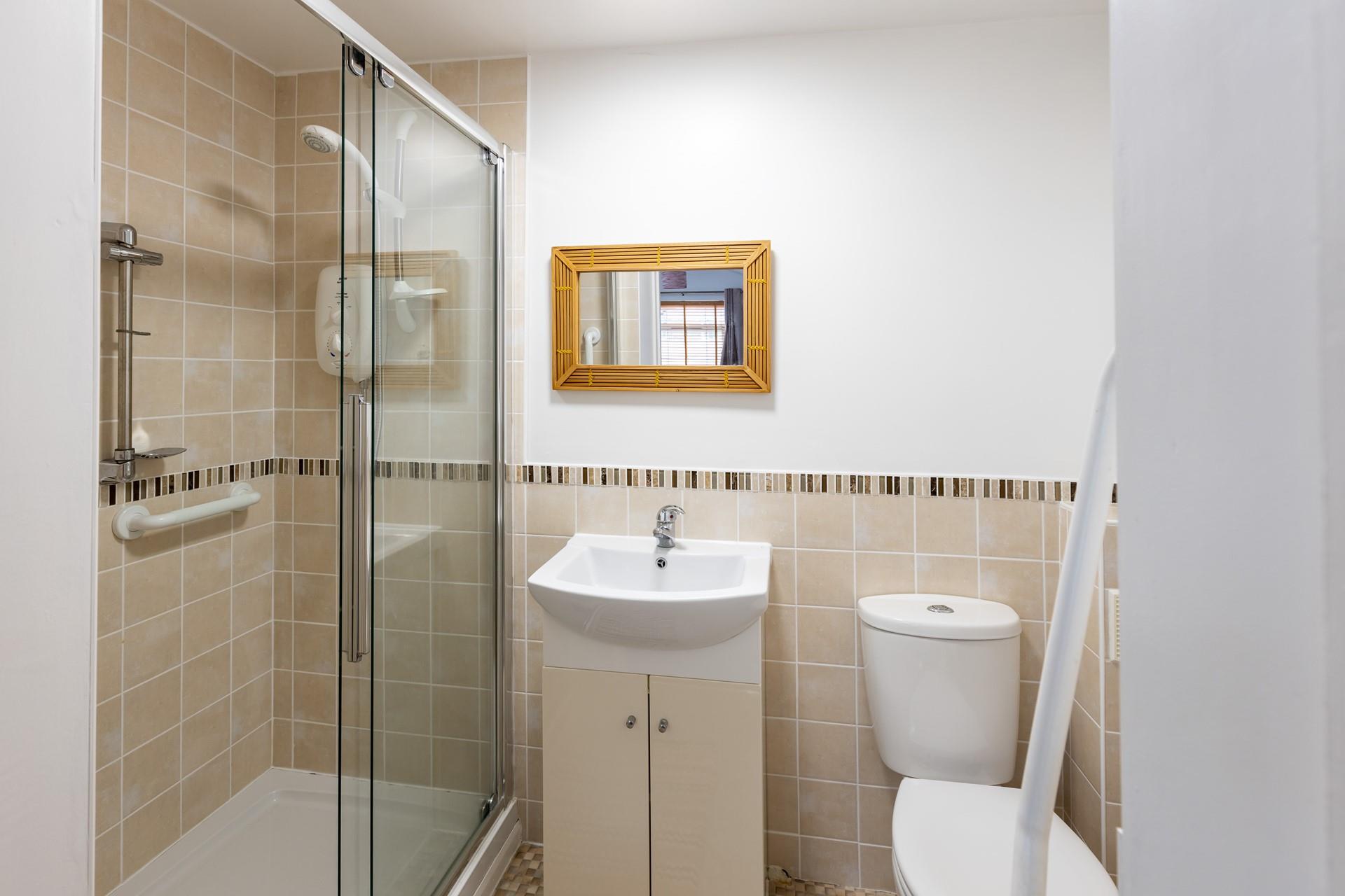 Wash off sandy toes in the shower after a day on Widemouth Bay beach.