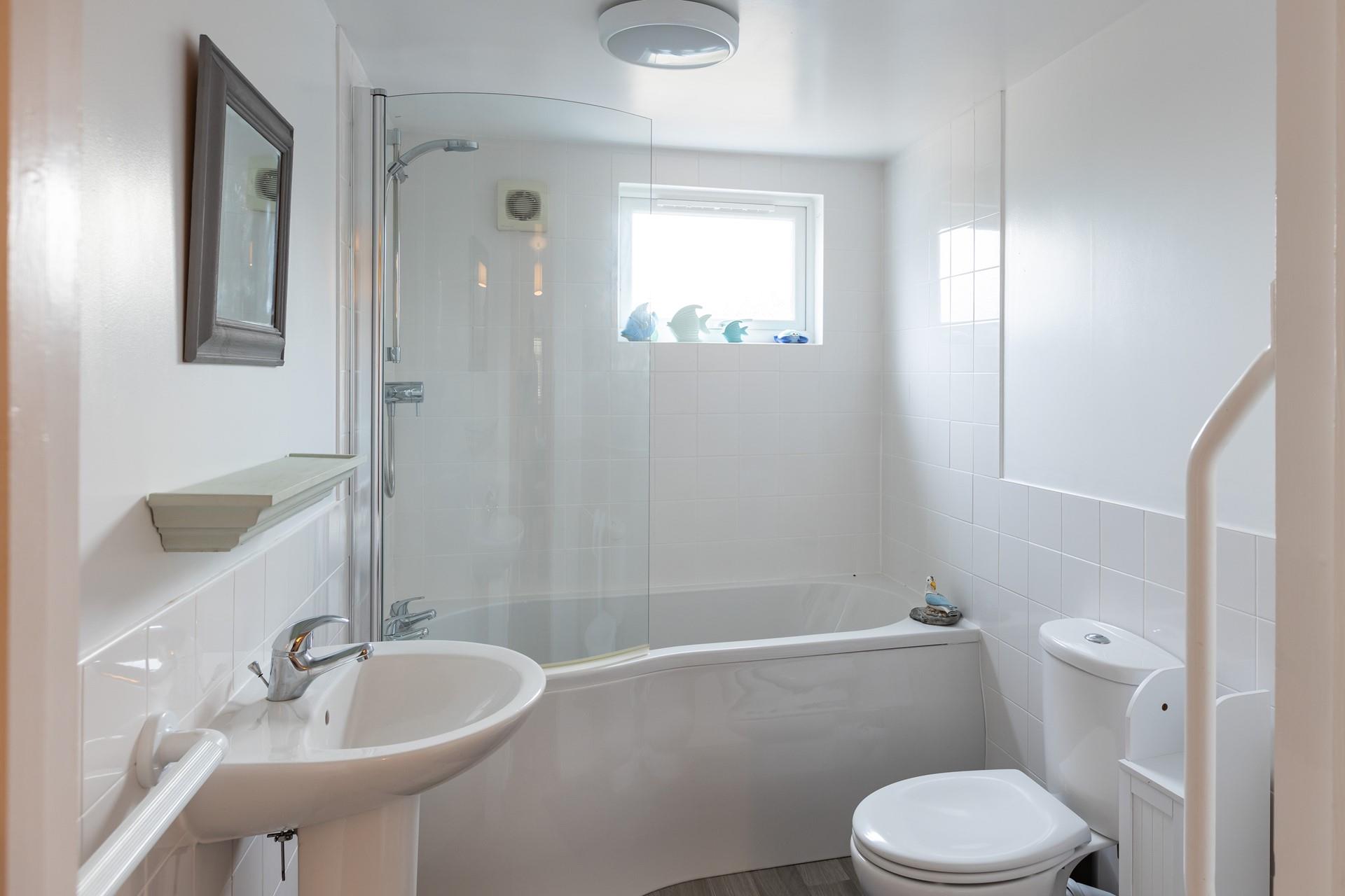 The family bathroom is a great space to get ready for the day or for sinking into a relaxing bath in the evening.