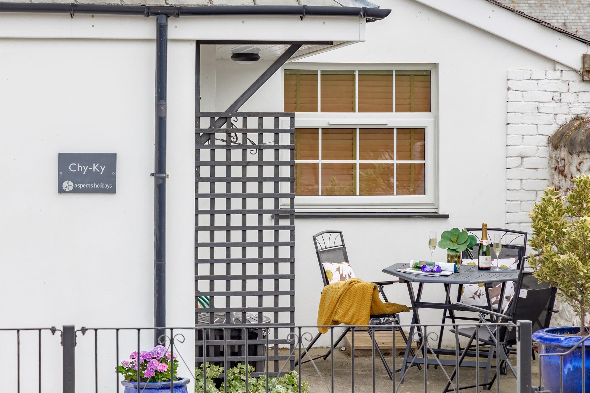 Soak up the sun in the pretty courtyard with a drink in hand.