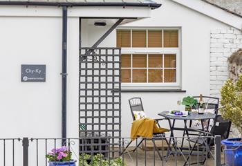 Soak up the sun in the pretty courtyard with a drink in hand.