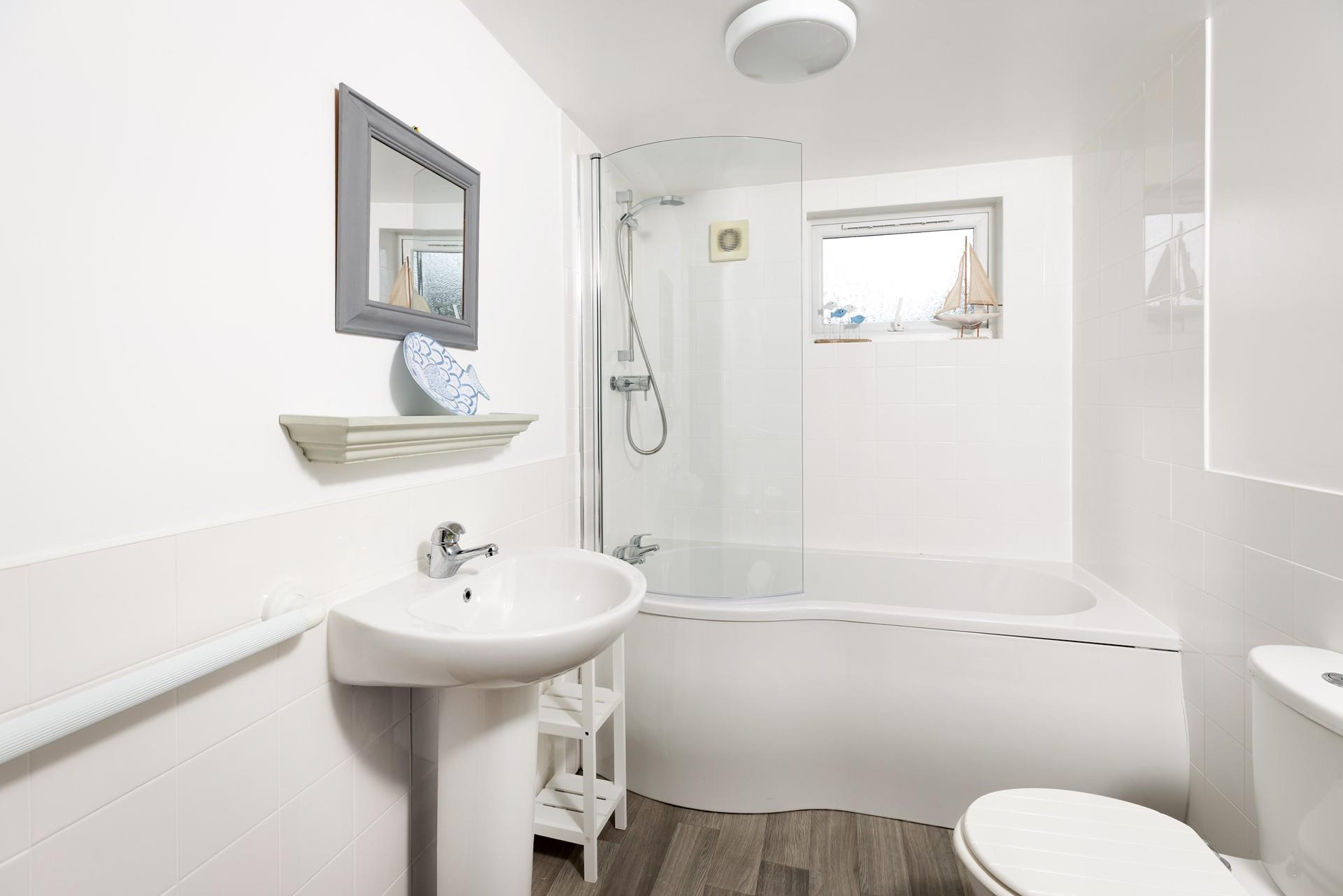 The family bathroom is a great space to get ready for the day or for sinking into a relaxing bath in the evening.