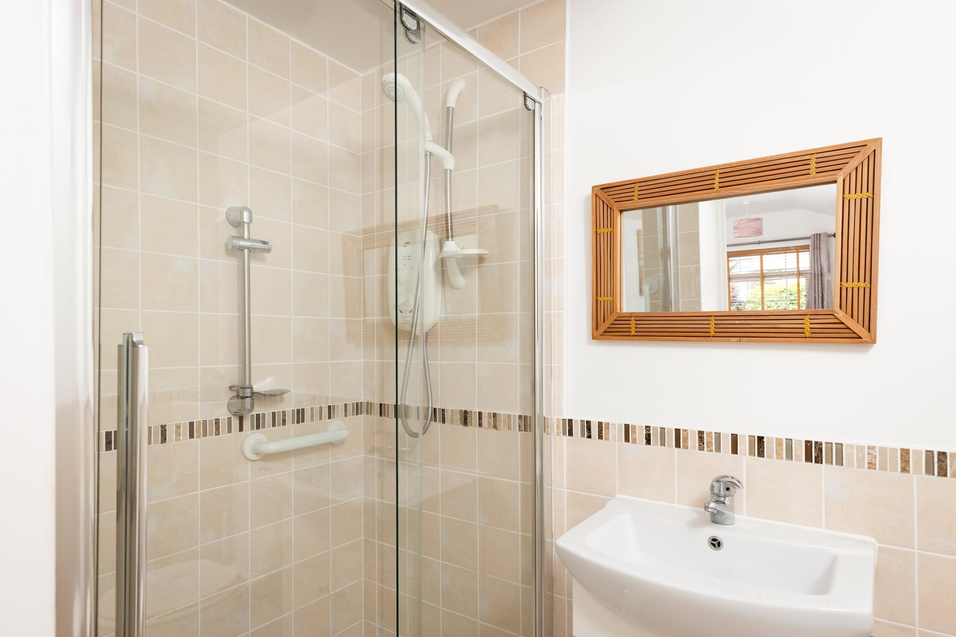 Wash off sandy toes in the shower after a day on Widemouth Bay beach.
