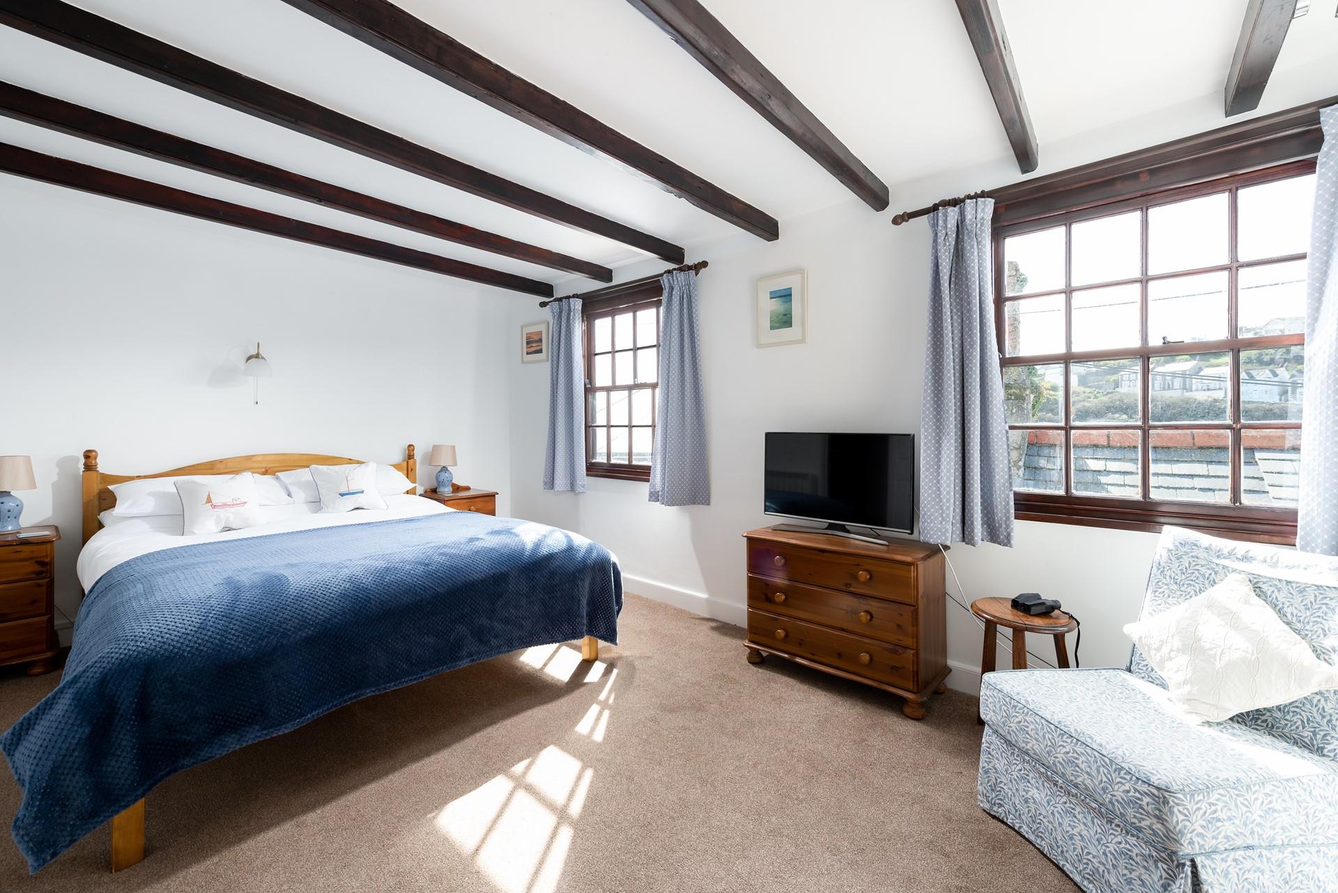Bedroom 1 benefits from harbour views so you can enjoy your morning drink of choice whilst watching the comings and goings of the harbour.
