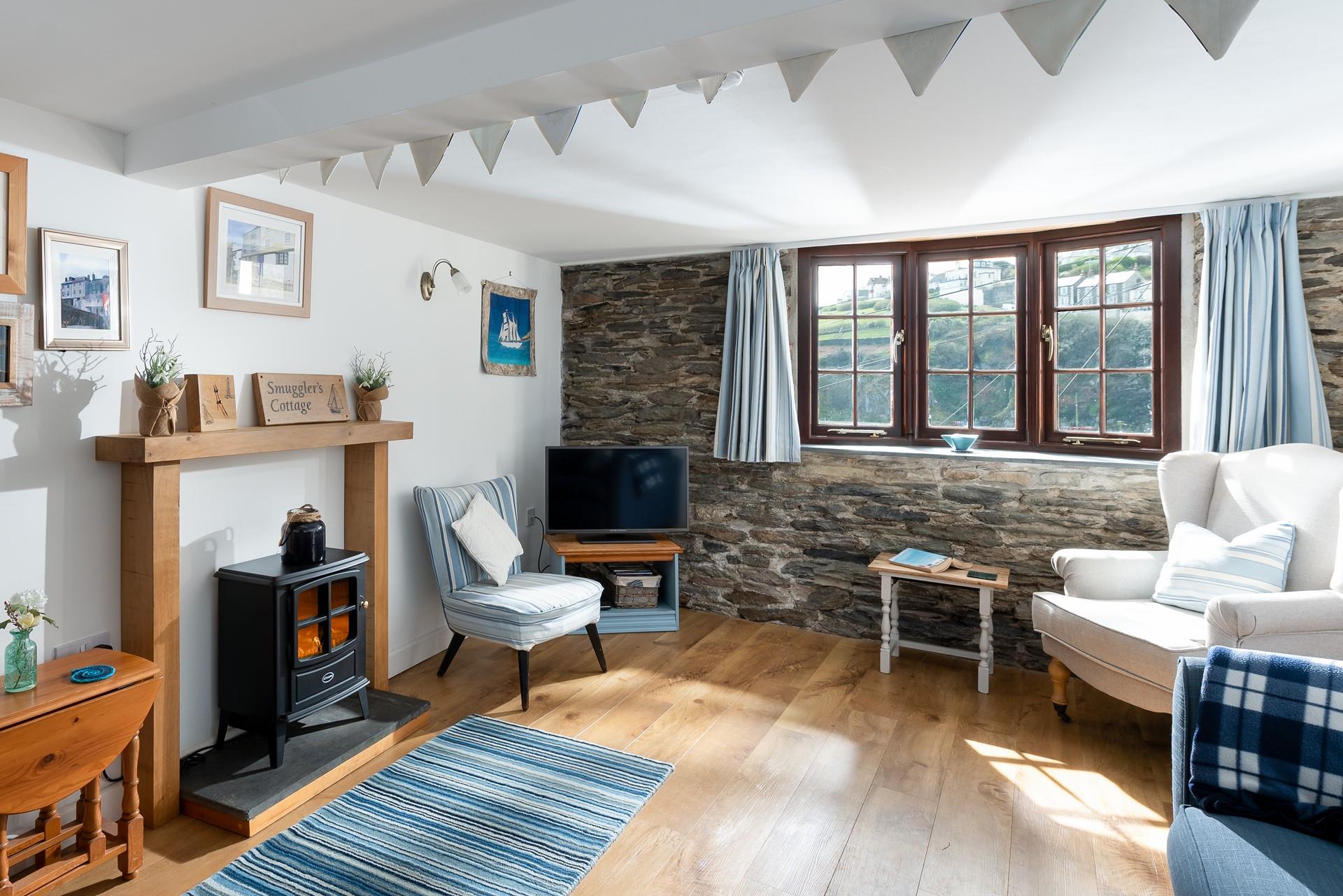 Steeped in history, this 18th-century cottage clings to the cliffside and offers incredible views over the harbour.