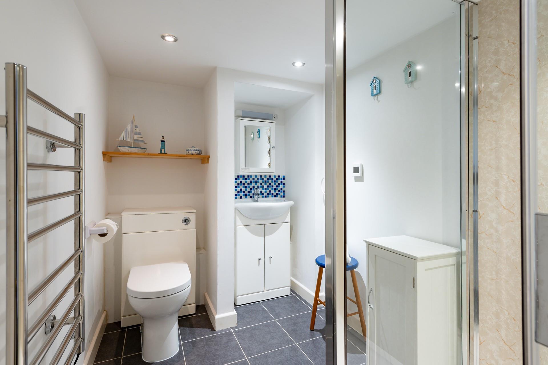 The sleek shower room is perfect for starting your day with an invigorating shower or freshening up before a night out!