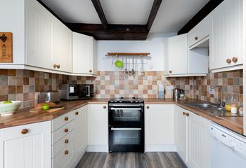 The kitchen has a farmhouse, country chic design, ensuring it is a homely and welcoming space to cook in.