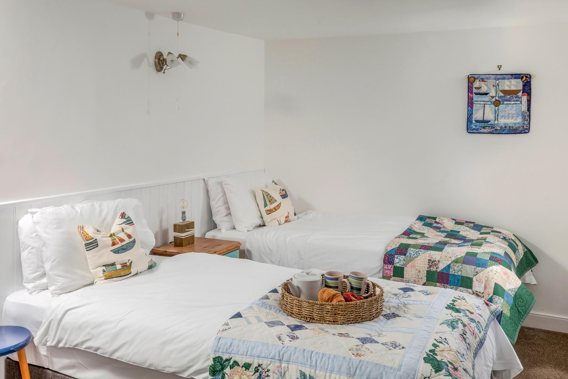 The twin room is a bright and quirky space, heavily inspired by the seaside and sure to delight children and adults alike!