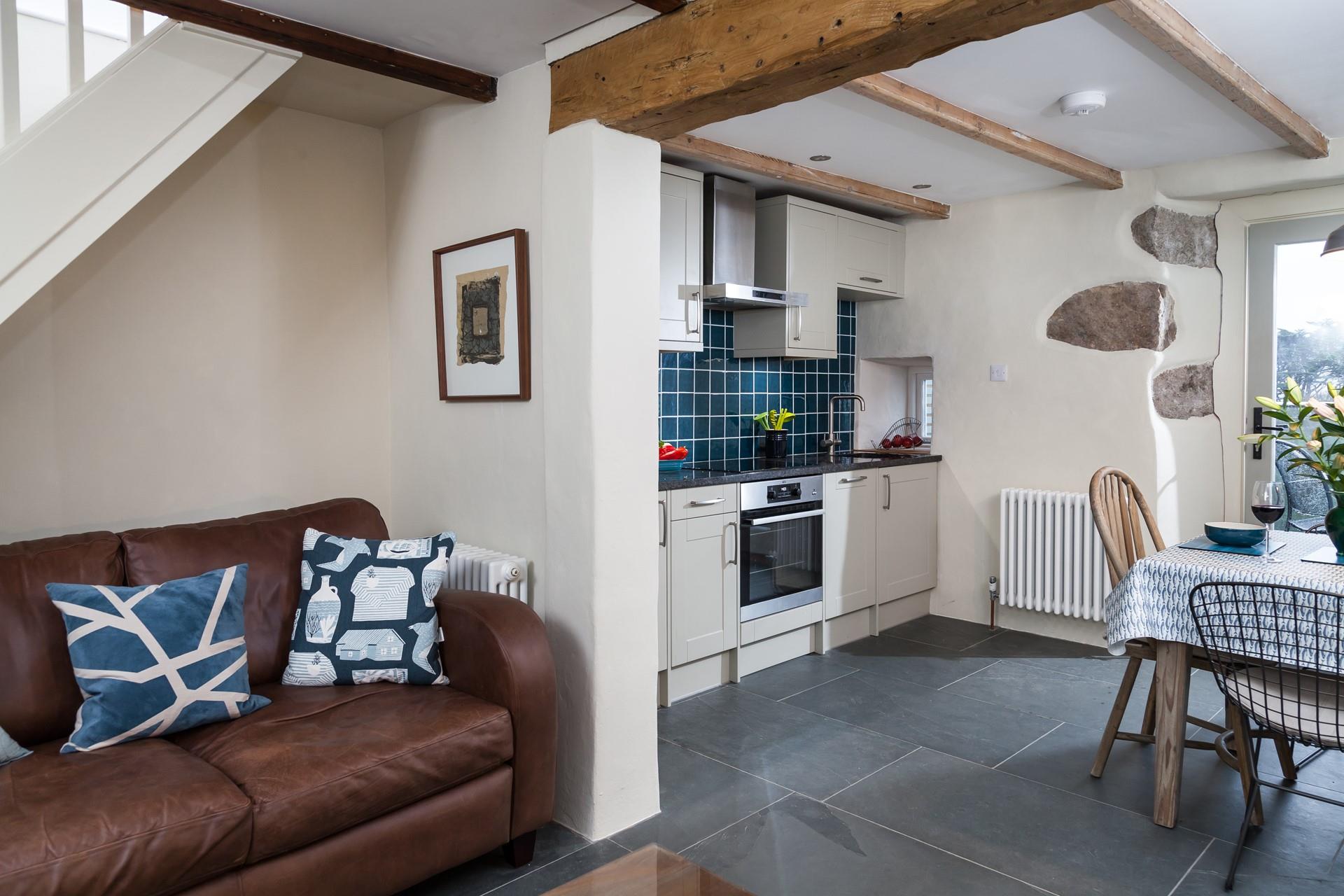 We love the original wooden beam that bridges the connecting kitchen and living room. 