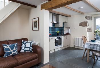 We love the original wooden beam that bridges the connecting kitchen and living room. 