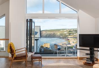 Bi-fold doors lead out from the open plan living space, to stunning views of Mawgan Porth and the surrounding valley. 