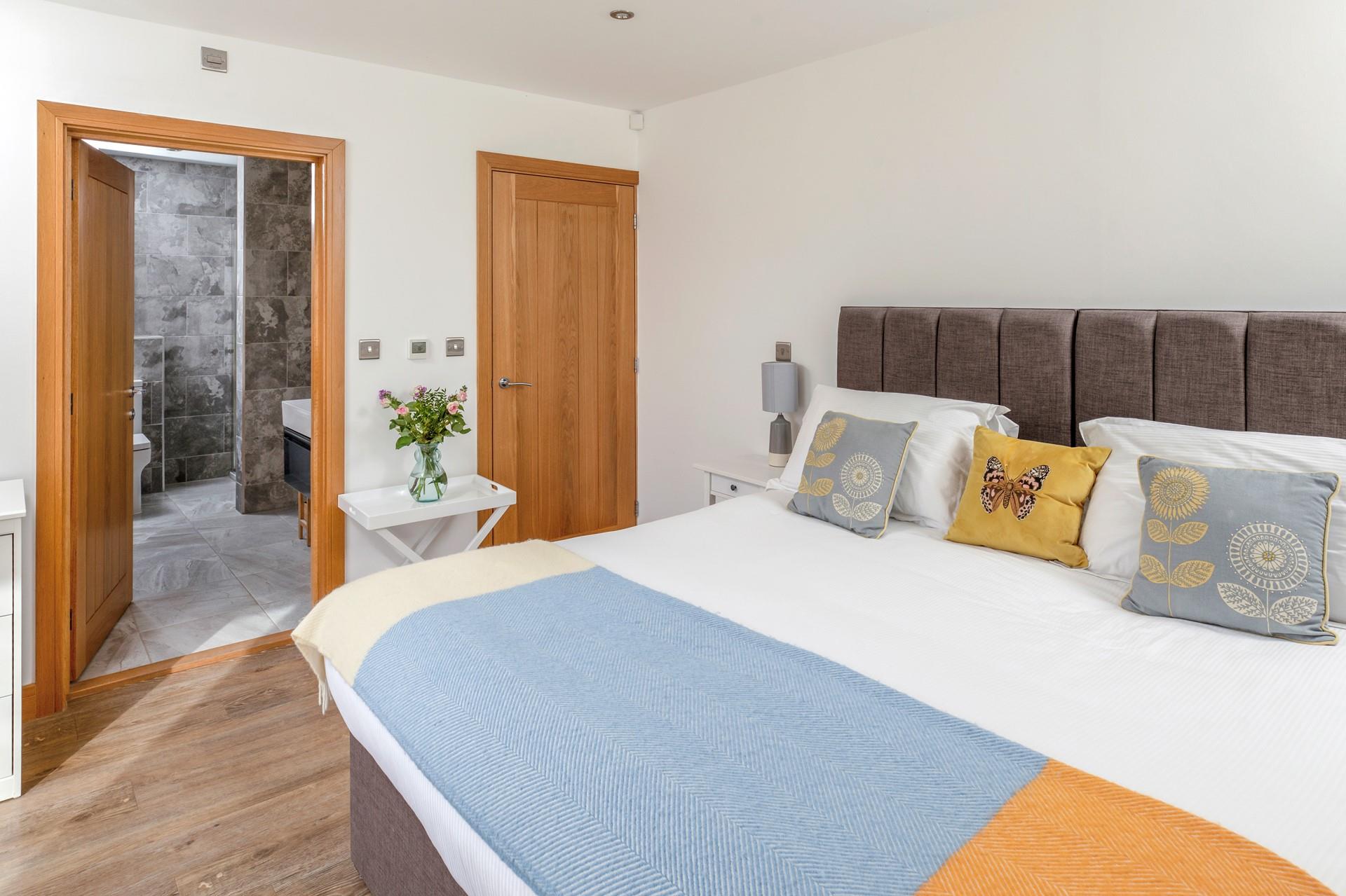 Step from the comfortable bed and into the stylish en suite.