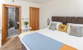 Step from the comfortable bed and into the stylish en suite. - Thumbnail Image