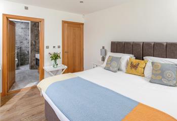 Step from the comfortable bed and into the stylish en suite.