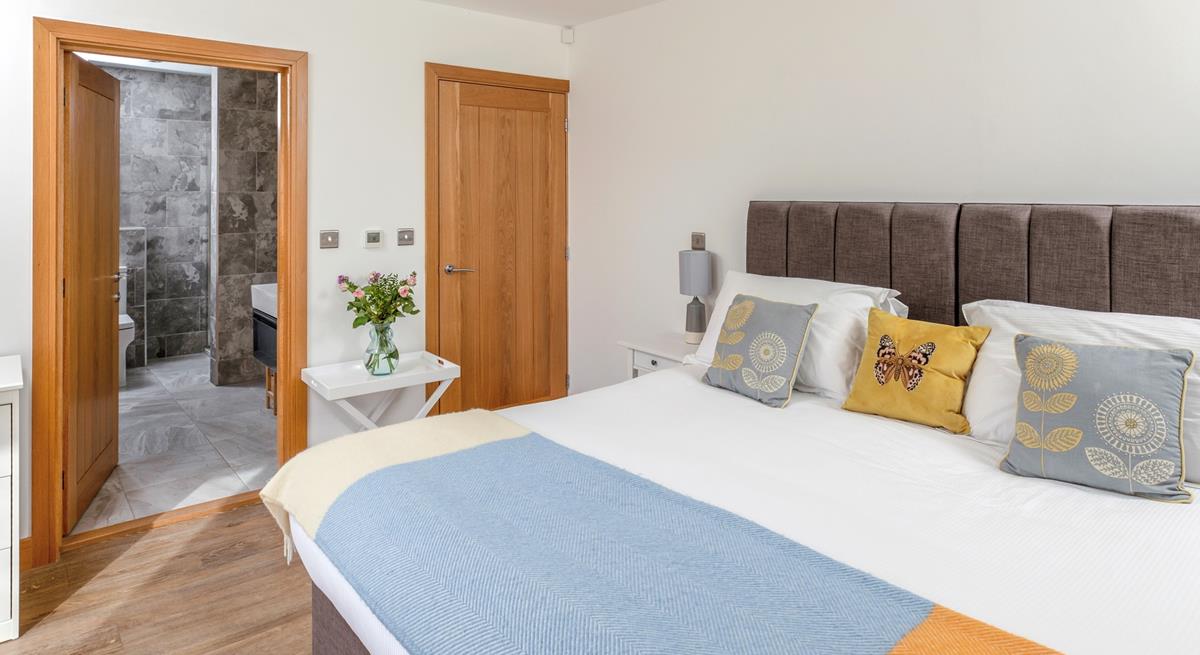 Step from the comfortable bed and into the stylish en suite.