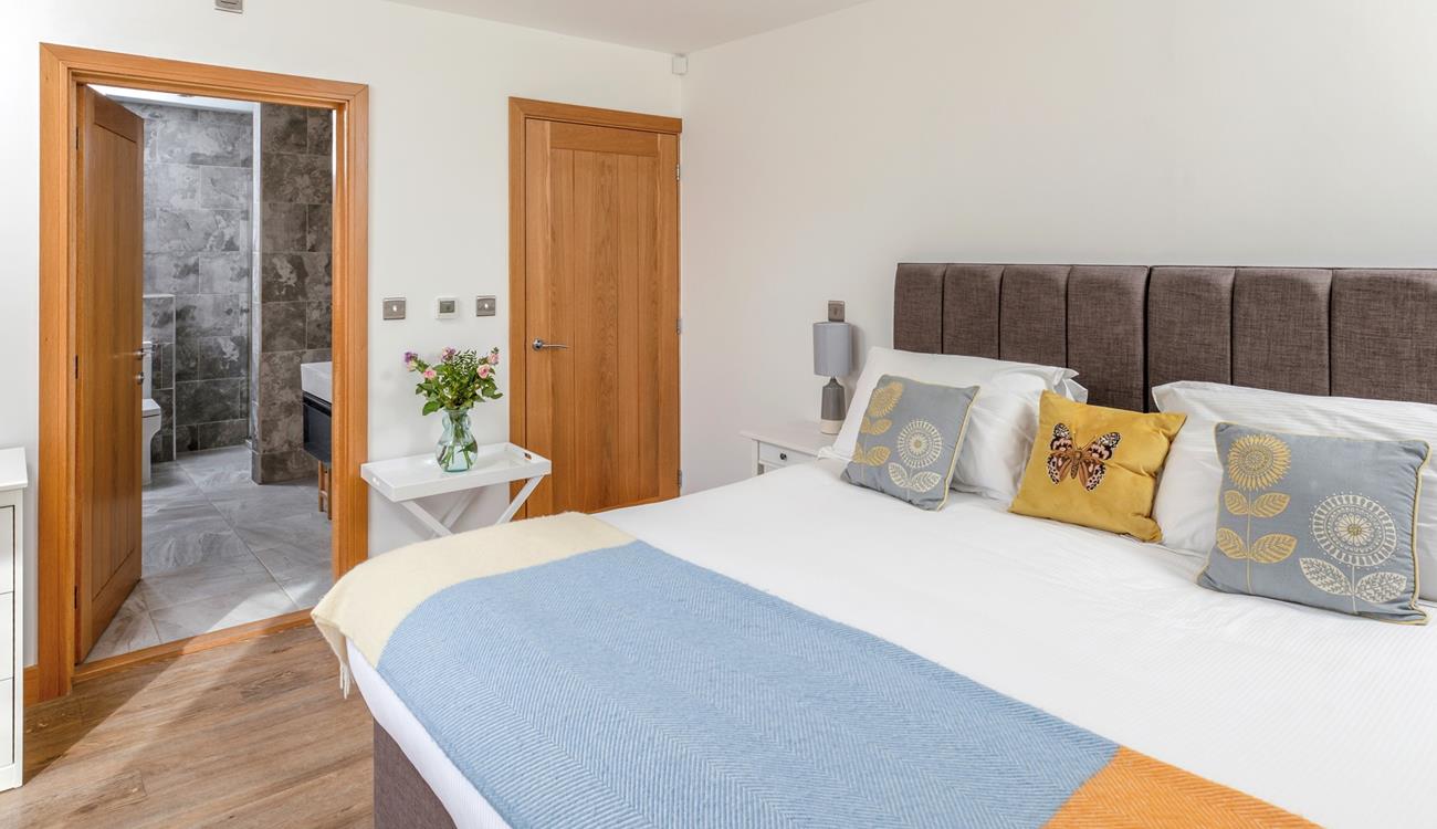 Step from the comfortable bed and into the stylish en suite.