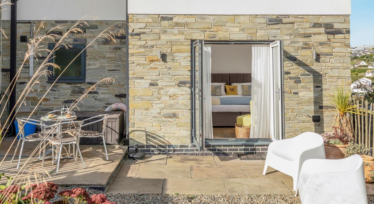 Bedroom 1 is at the back of the house, with doors leading out into the garden. 