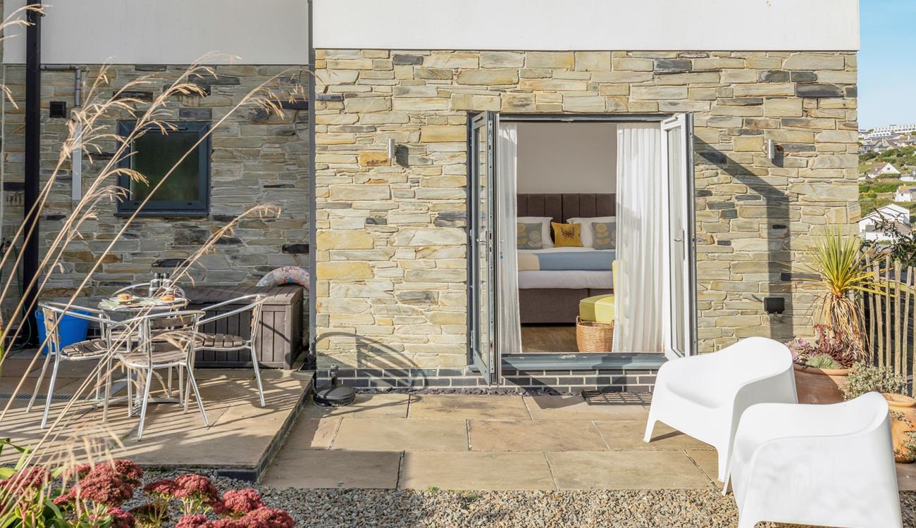 Bedroom 1 is at the back of the house, with doors leading out into the garden. 