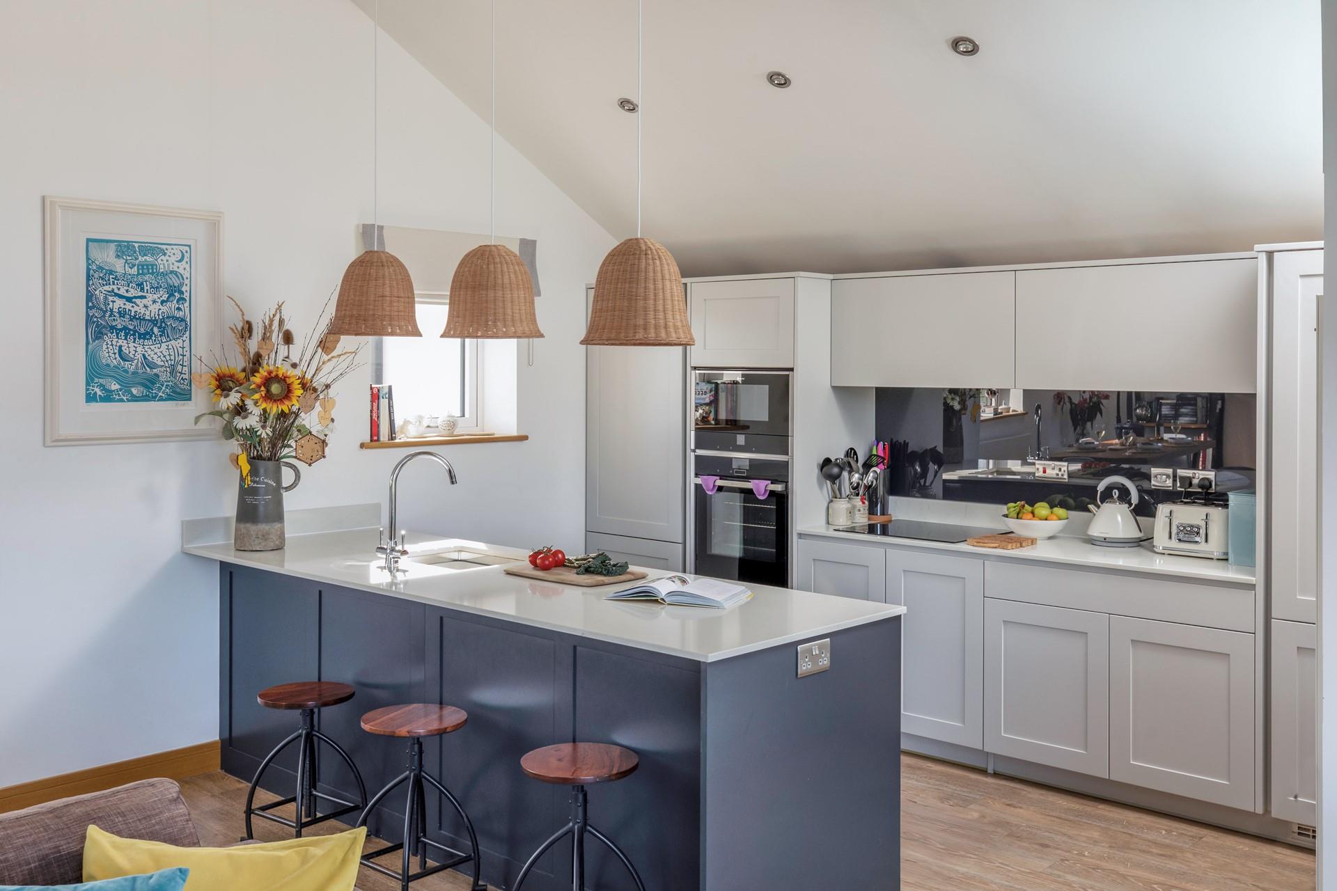The kitchen is ideal for cooking and socialising with the modern breakfast bar.