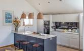 The kitchen is ideal for cooking and socialising with the modern breakfast bar. - Thumbnail Image