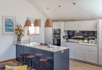 The kitchen is ideal for cooking and socialising with the modern breakfast bar.