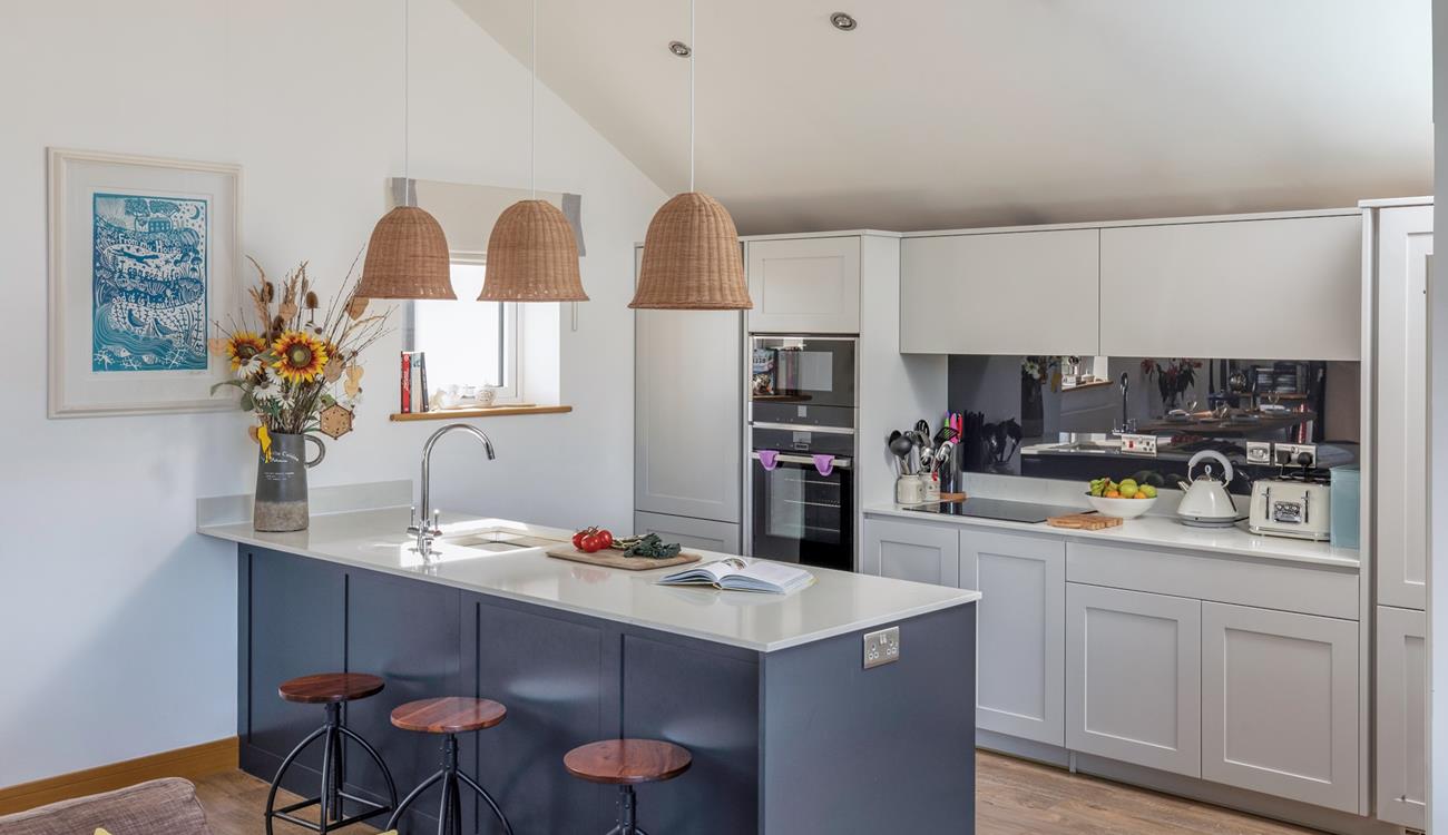 The kitchen is ideal for cooking and socialising with the modern breakfast bar.