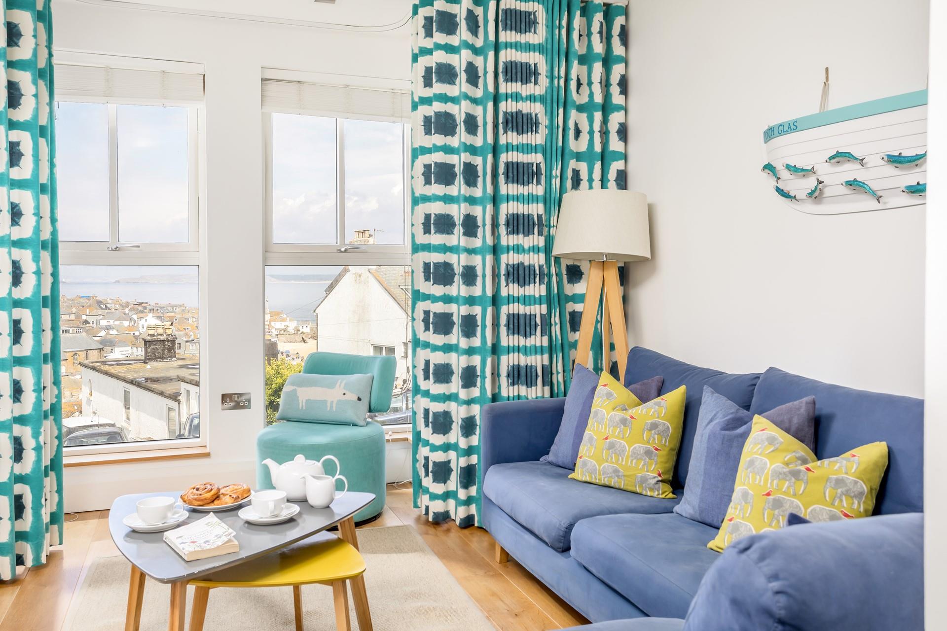 Sit back and relax with a cup of tea gazing out at the blue waters across the Bay.