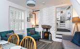 Sit back and relax in front of the roaring wood burner, perfect for warming yourself back up after a fresh beach walk.  - Thumbnail Image