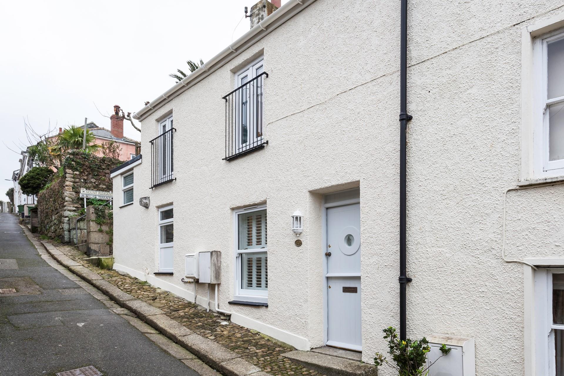 The property has a traditional stable door with a quirky porthole window to reflect its seaside location.