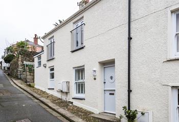 The property has a traditional stable door with a quirky porthole window to reflect its seaside location.