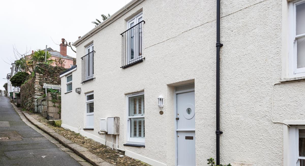 The property has a traditional stable door with a quirky porthole window to reflect its seaside location.
