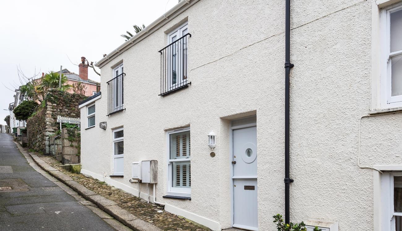 The property has a traditional stable door with a quirky porthole window to reflect its seaside location.