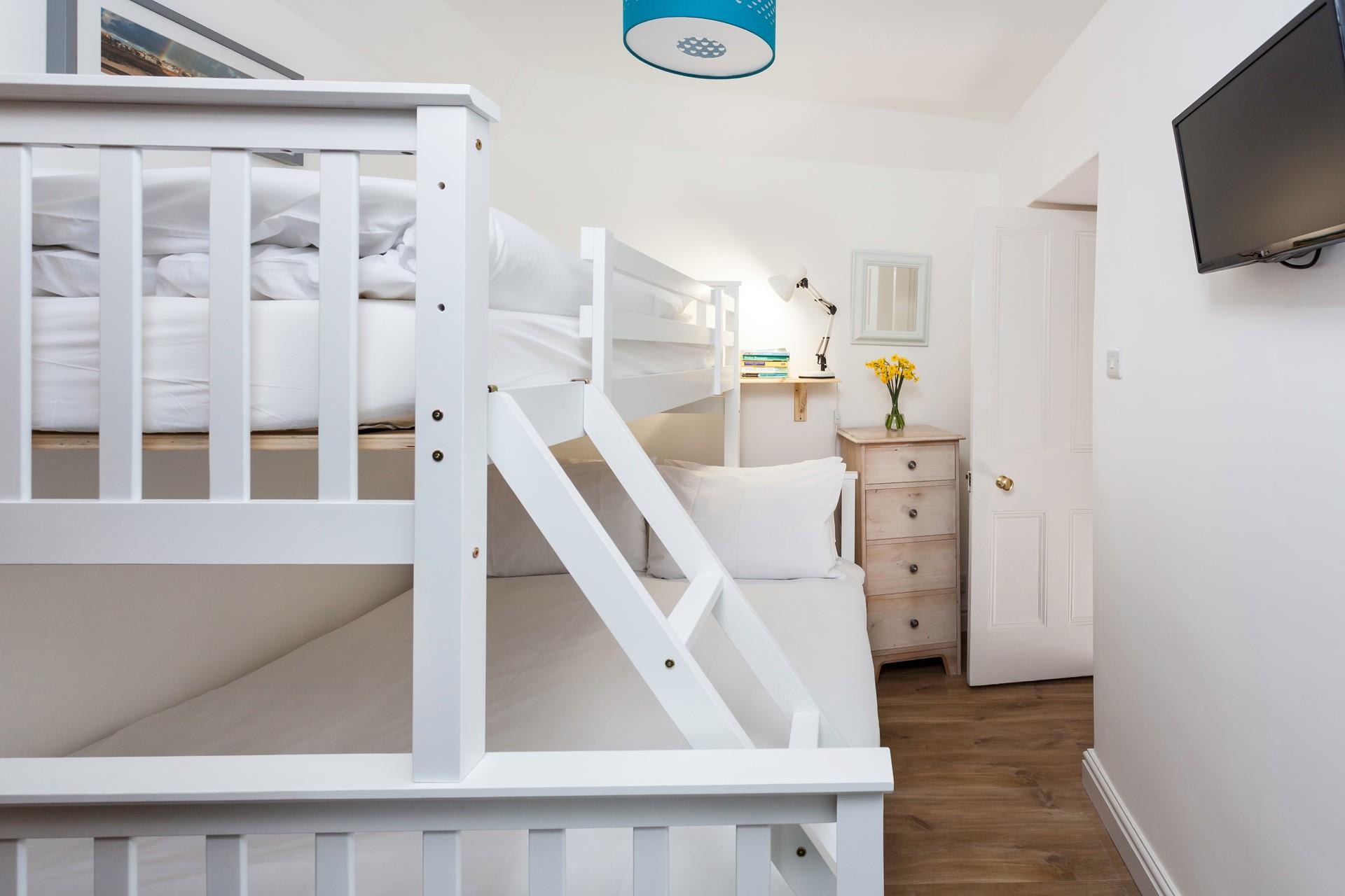 Bedroom 2 has been furnished to accommodate another couple or children. 