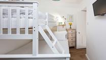 Bedroom 2 has been furnished to accommodate another couple or children. 