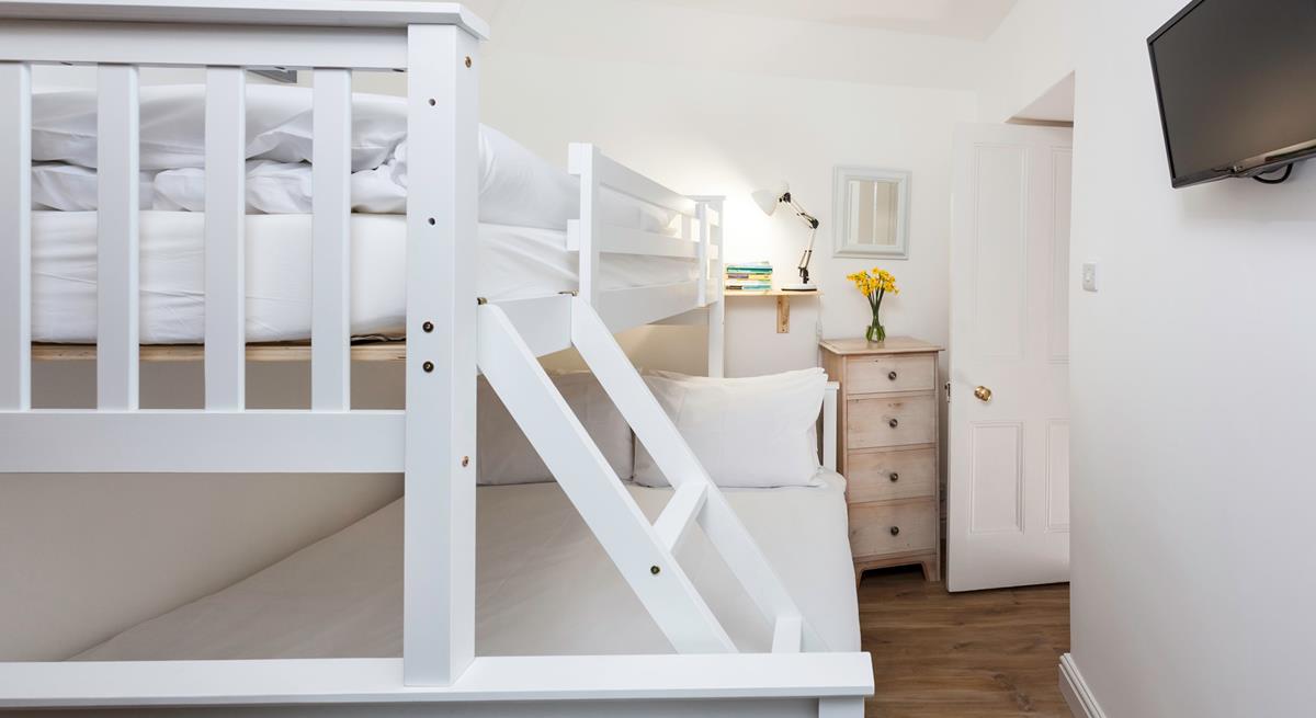 Bedroom 2 has been furnished to accommodate another couple or children. 