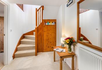 Under stair storage is handy for popping coats or beach gear away.