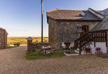 Enjoy an evening tipple on the picnic bench as the sun goes down. 