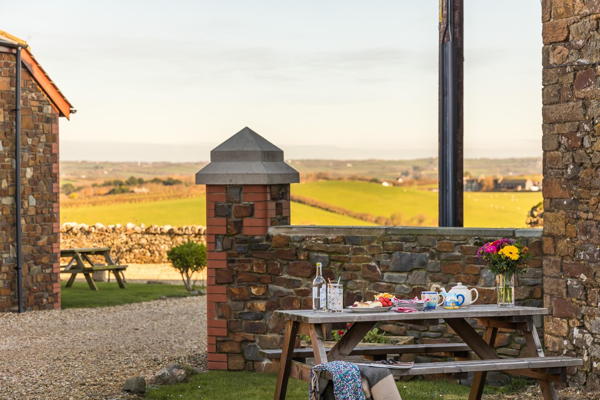 Enjoy a delicious cream tea overlooking the far-reaching rural views.