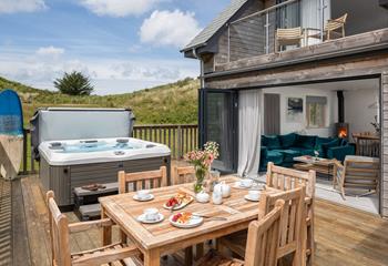 Enjoy al fresco eating on the deck sheltered by the sand dunes.