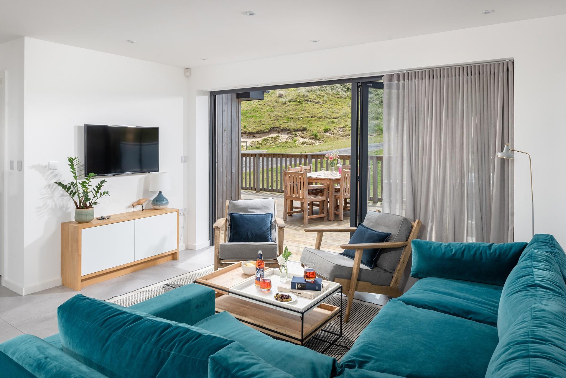 Open the bi-fold patio doors and let in the Cornish sea air.