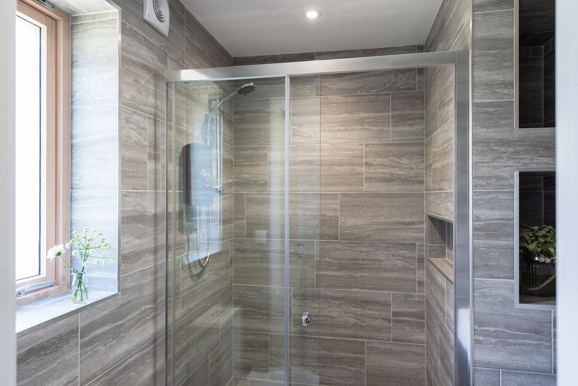 Ground floor walk-in en suite shower room, perfect for rinsing those sandy toes!