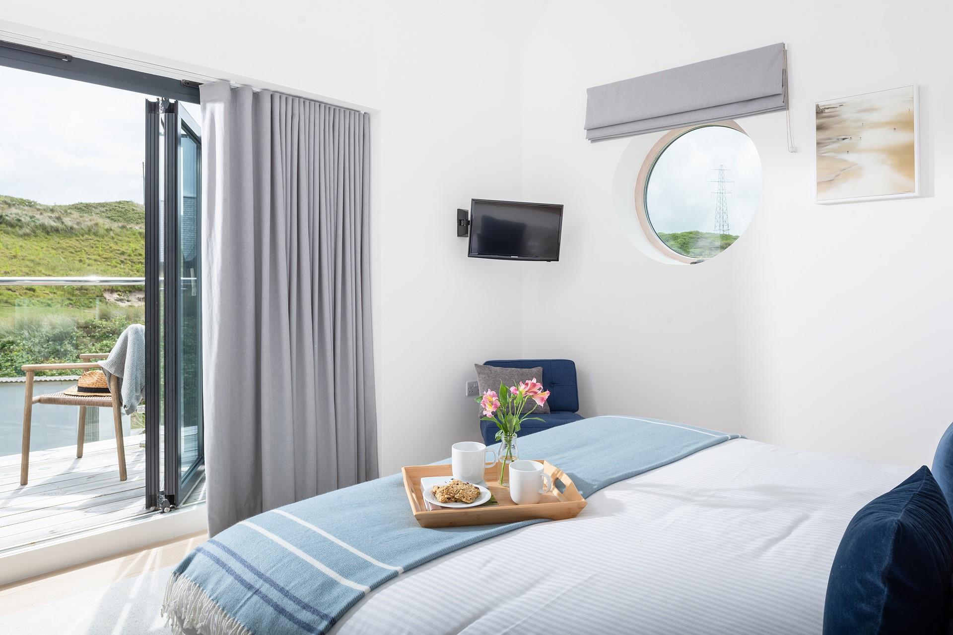 The master king size bedroom has a private balcony boasting dune views.