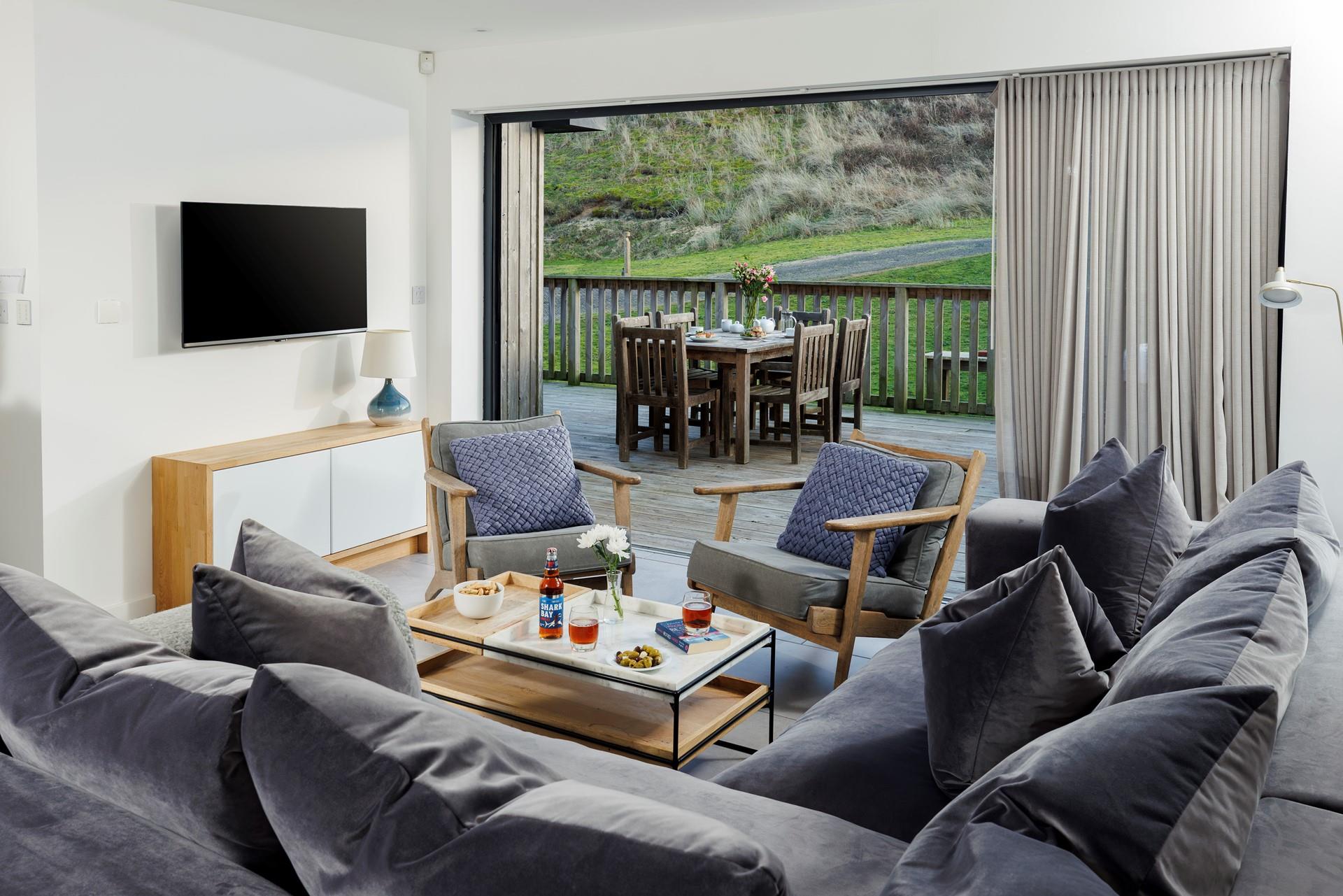 Open the bi-fold patio doors and let in the Cornish sea air.