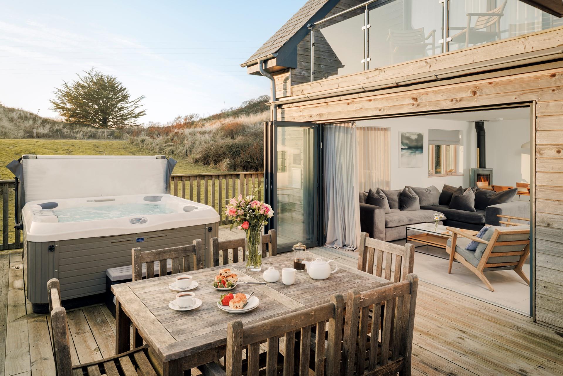 Climb into the hot tub or enjoy al fresco dining on the deck sheltered by the sand dunes.