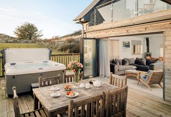 Climb into the hot tub or enjoy al fresco dining on the deck sheltered by the sand dunes.