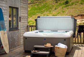 Relax and unwind in your bubbling hot tub.