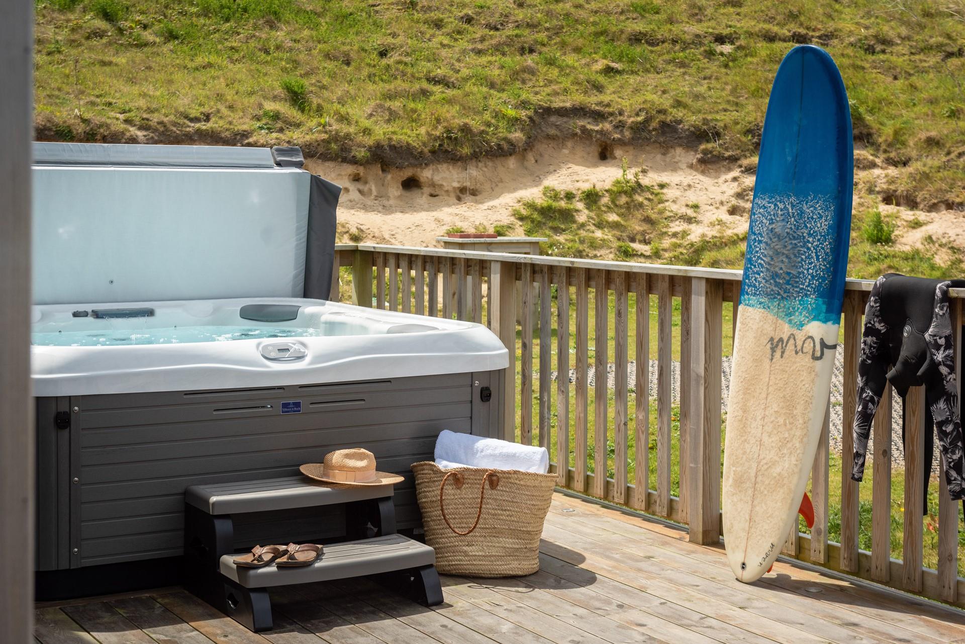 After a day of catching some Cornish waves, relax in your very own hot tub.
