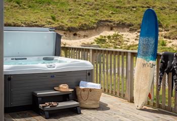 After a day of catching some Cornish waves, relax in your very own hot tub.