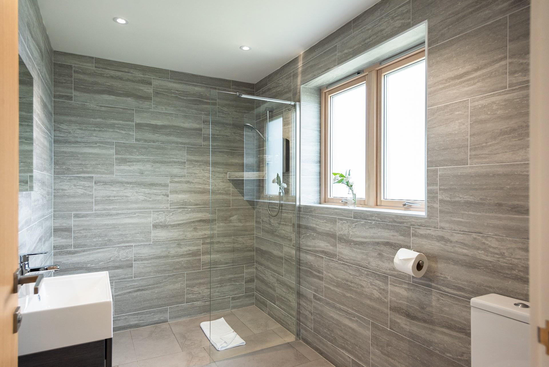 The large walk-in shower means you can enjoy long beach days and come back and wash off your sandy toes in a luxury bathroom.